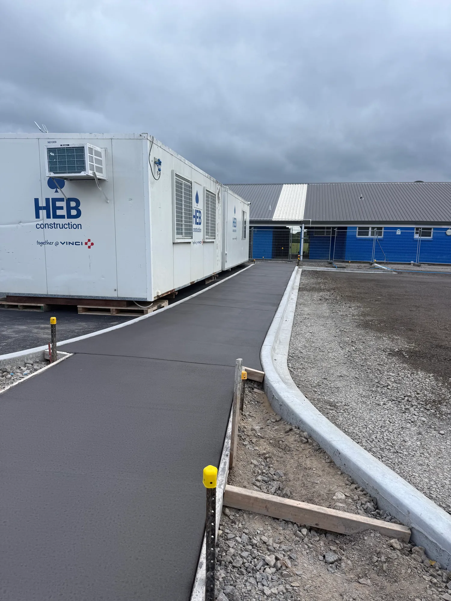 Commercial concrete pathway and kerb completed by JRM Concreting